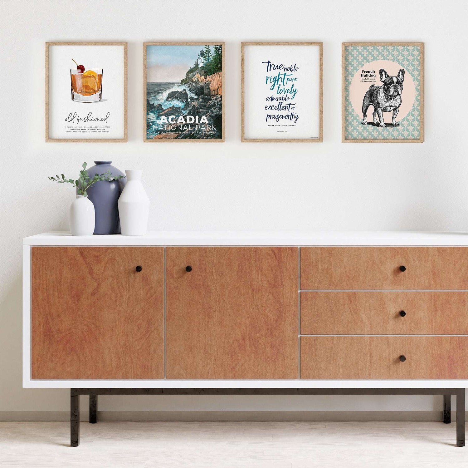 Framed wall art from Mod Day Art styled above a console table with decor accents