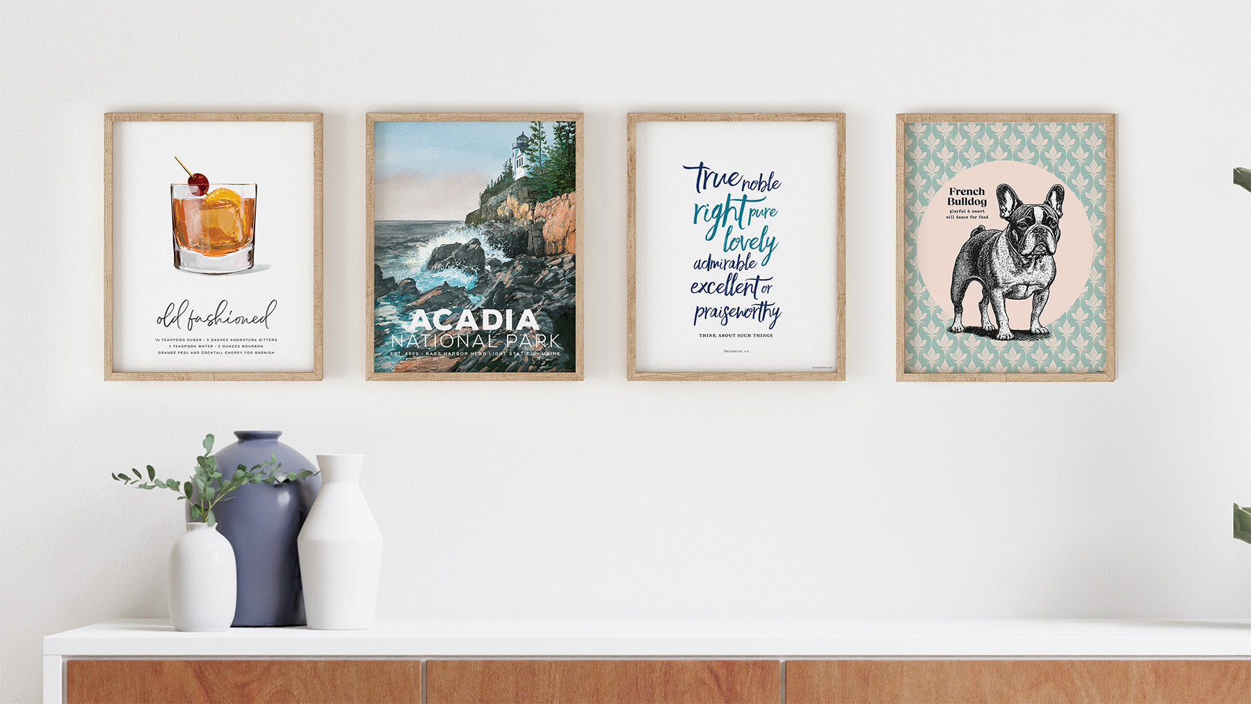 Mod Day Art all wall art collection image with framed pictures shown on white wall with console.