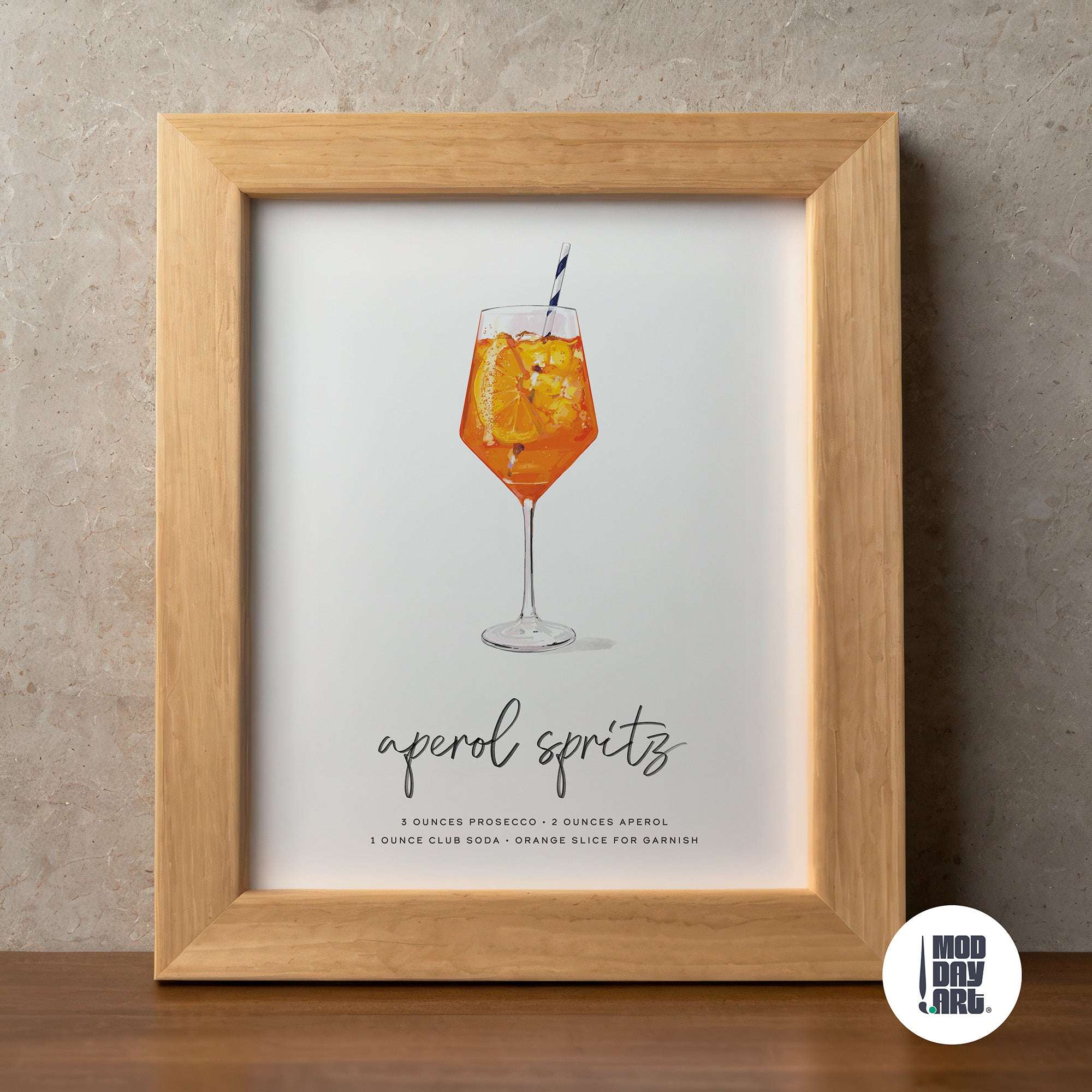 Framed print of an aperol spritz recipe cocktail wall art with a glass illustration on a textured wall.
