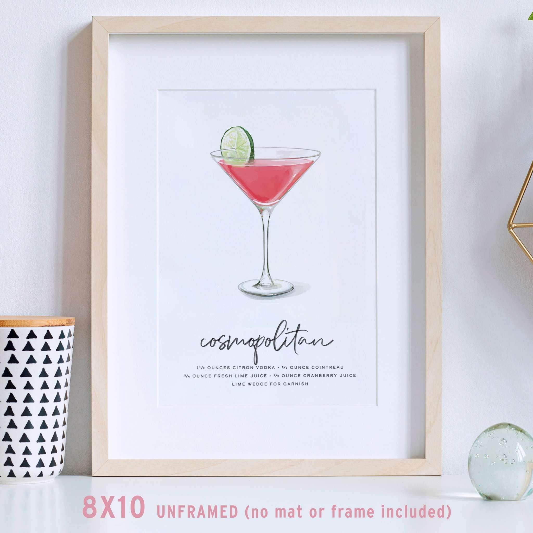 Cosmopolitan cocktail wall art displayed in a modern frame, elegantly leaning against a wall.