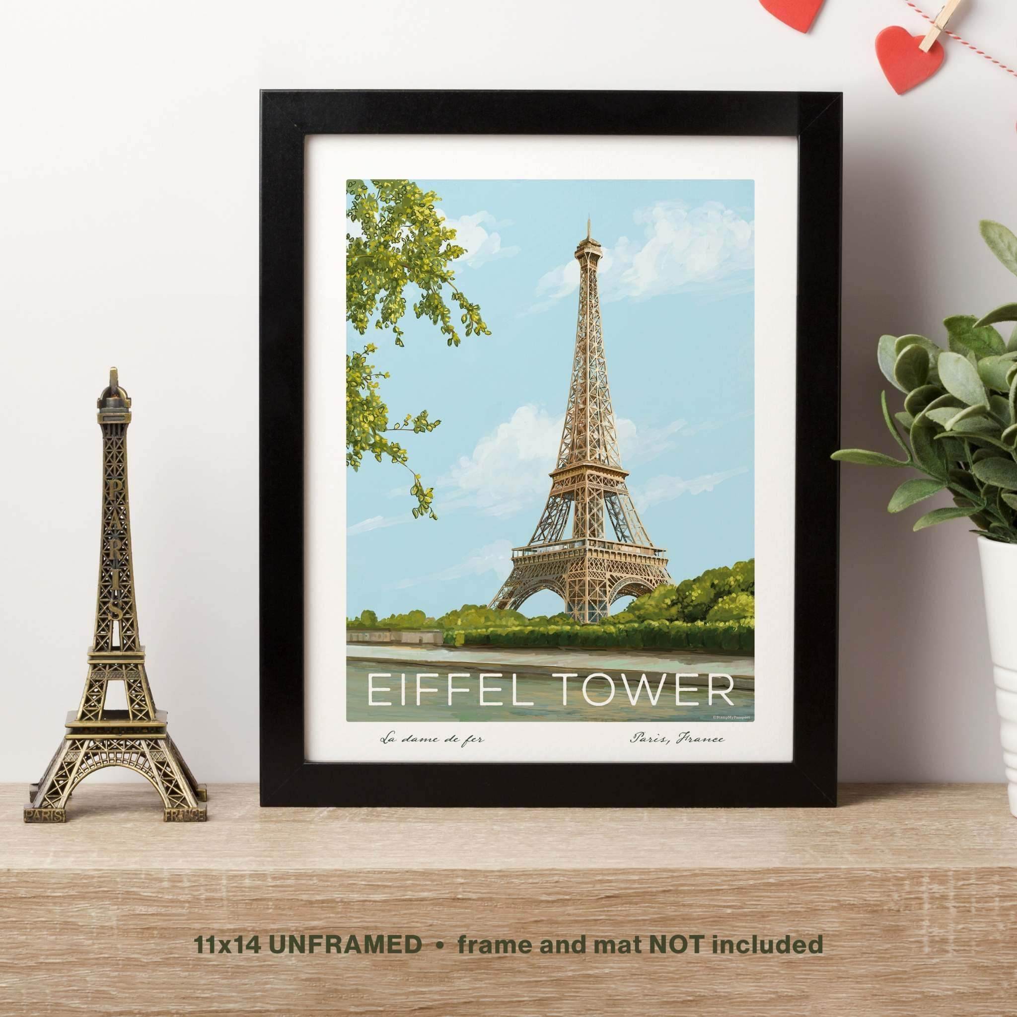 Paris Wall Art featuring the Eiffel Tower print in a black frame (frame not included), displayed alongside an Eiffel Tower souvenir for a charming Parisian touch.