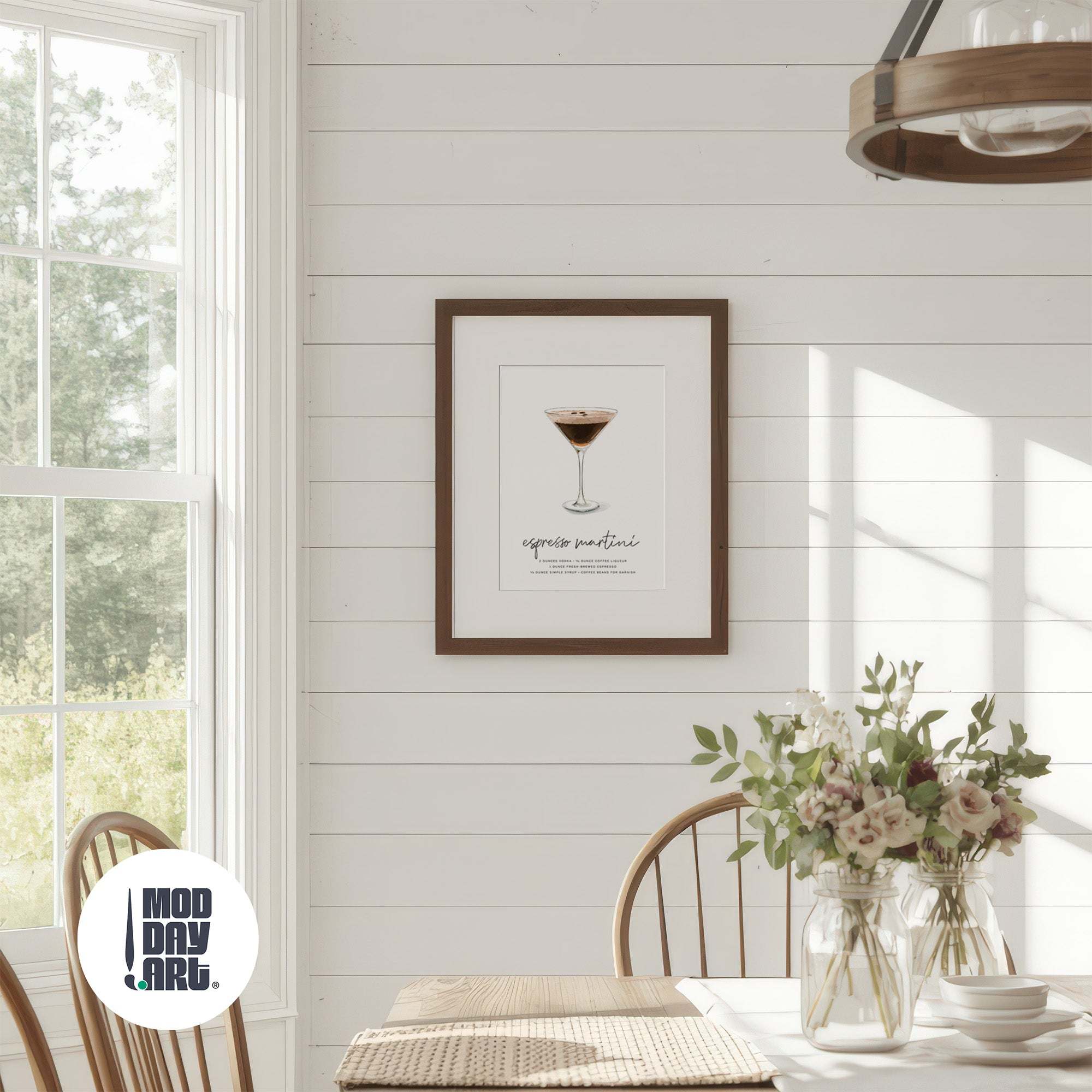 Dining room with framed Espresso Martini cocktail artwork on the wall, featuring a glass of red wine.
