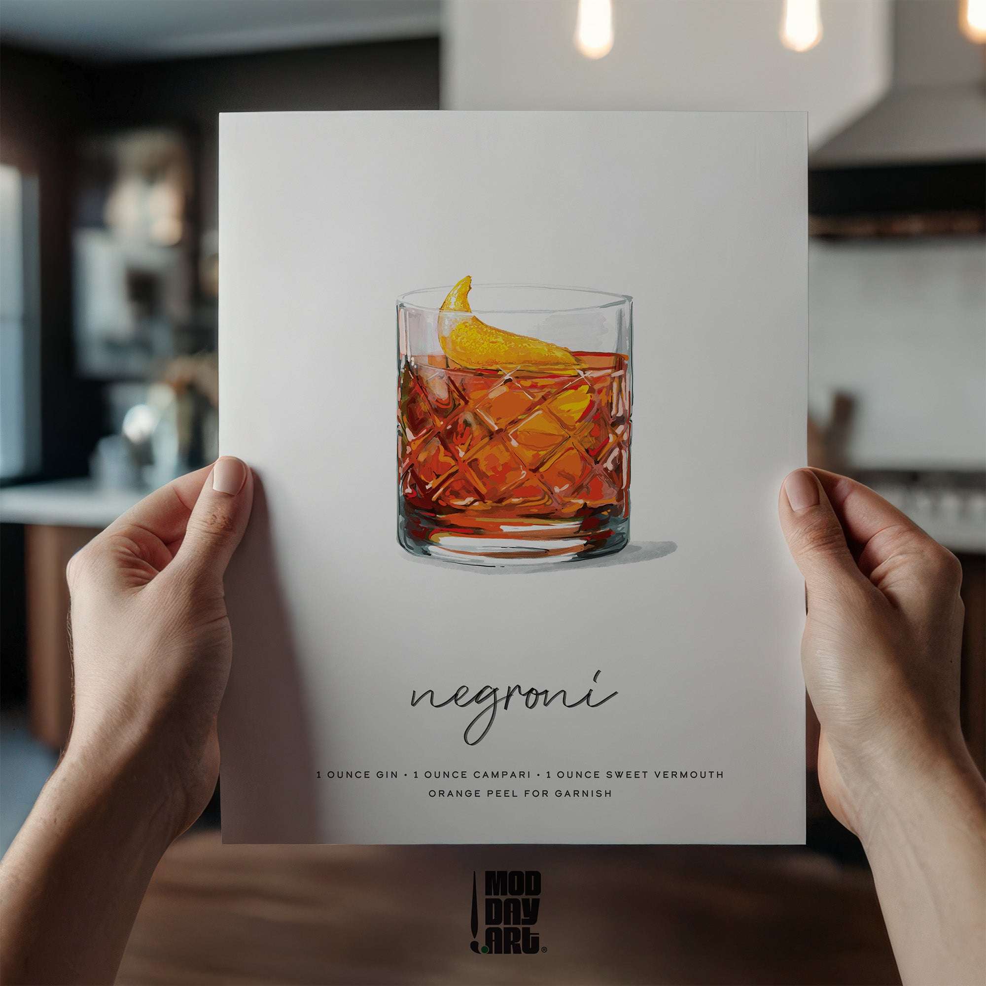Person holding a Negroni recipe cocktail wall art for a Negroni cocktail in a kitchen setting