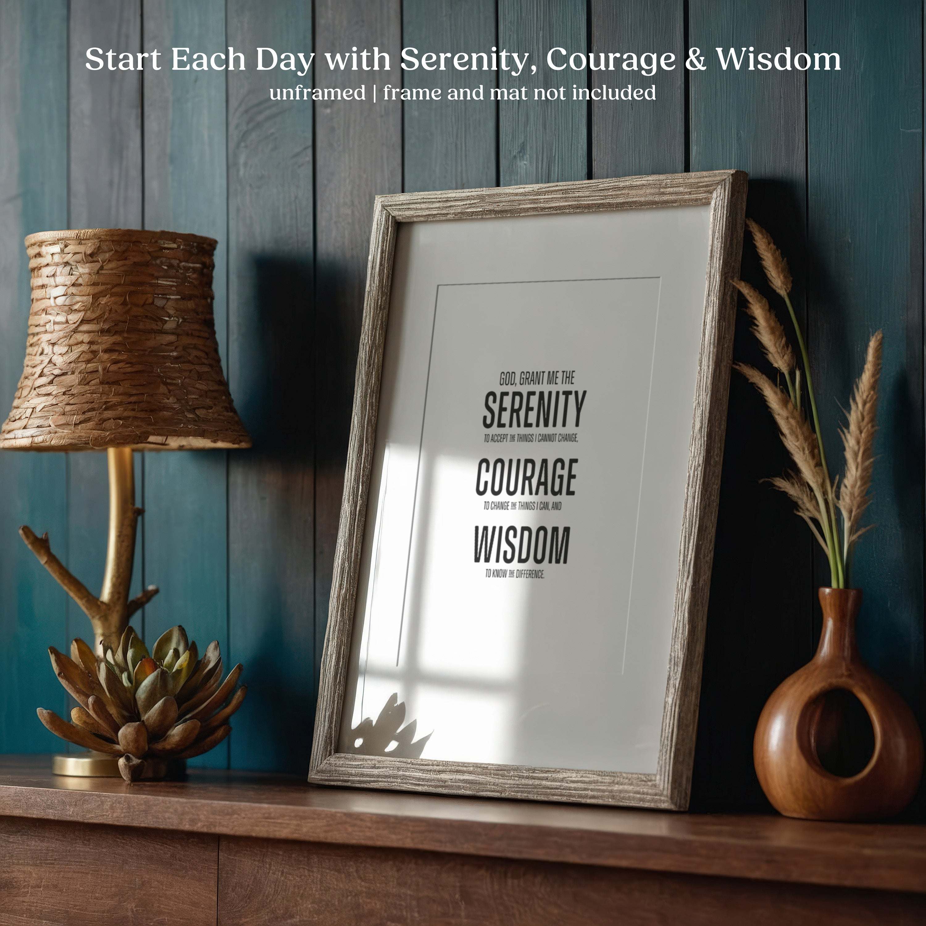 Framed Serenity Prayer Wall Art  with motivational quote on a wooden shelf with decorative items.