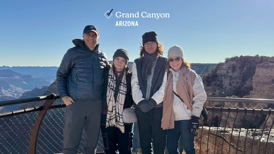 Our family at the Grand Canyon National Park, celebrating another park checked off our Checklist of National Parks.