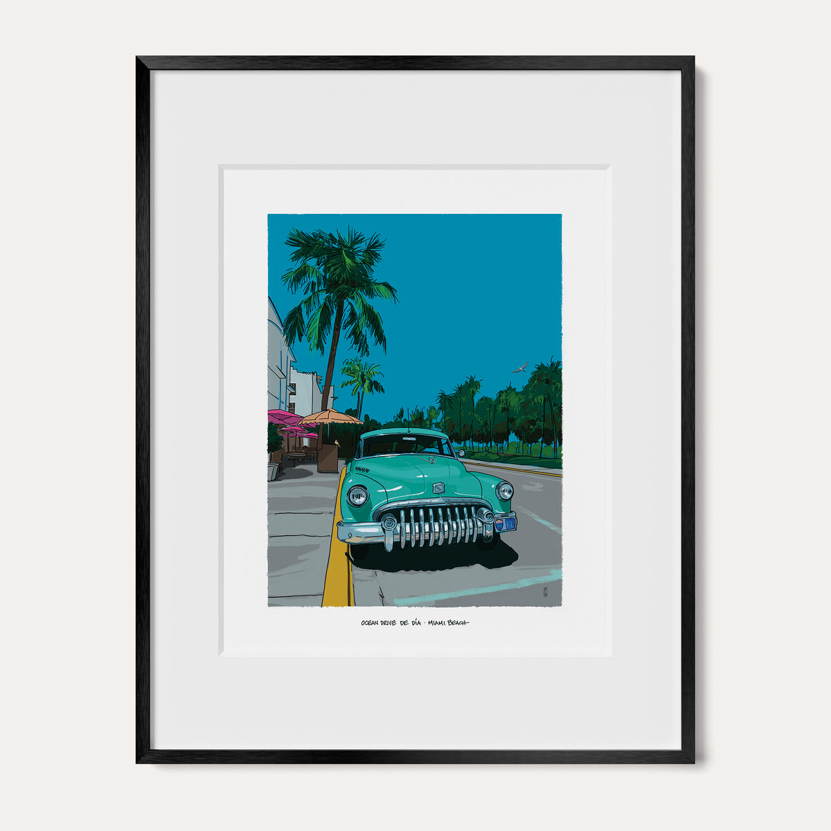 Ocean Drive by Day Miami Beach art print in a black metal frame with a white mat, shown as the 11 x 14 inch frame matted to 8 x 10. A mint-green vintage Buick sits on Ocean Drive under palm trees and a blue sky.