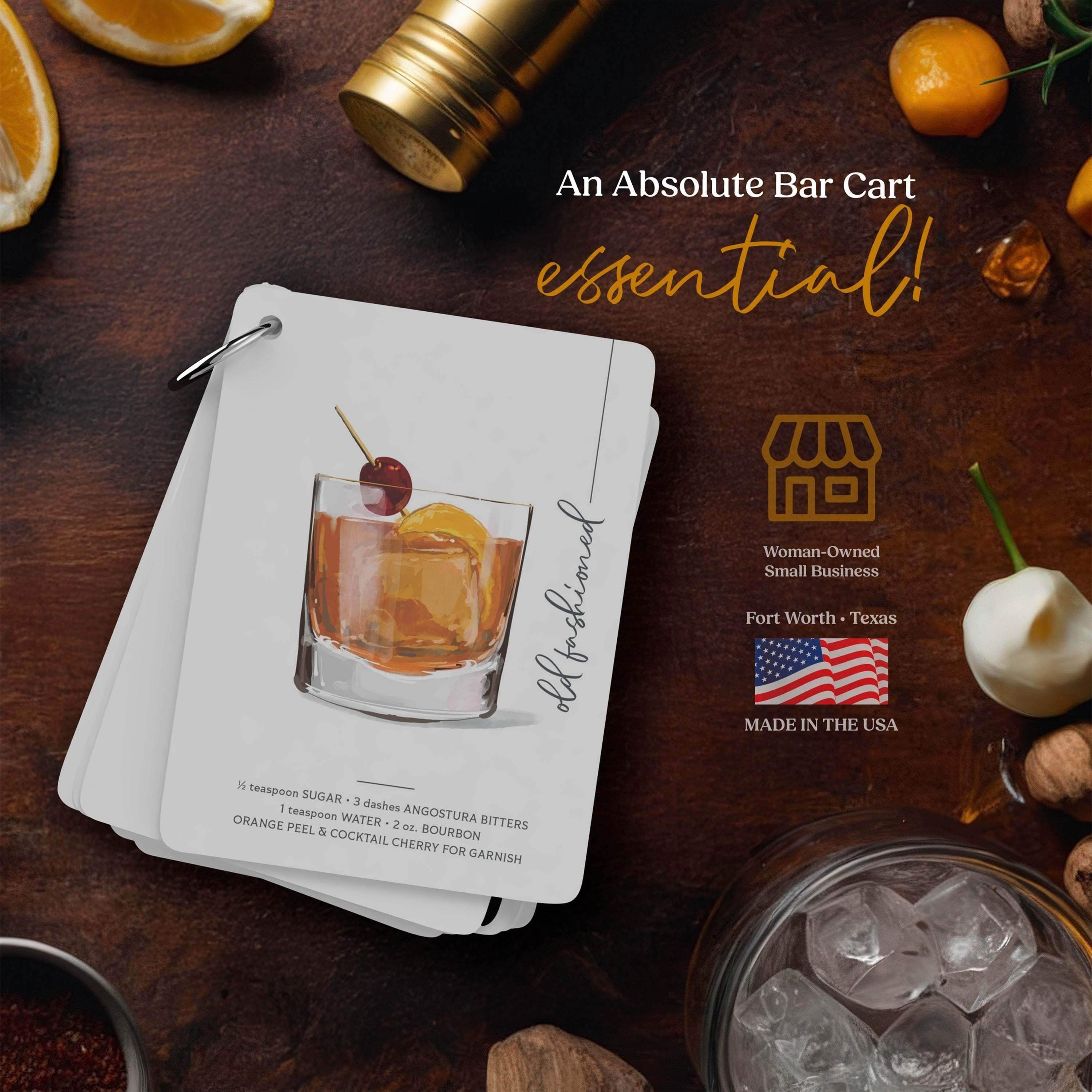 Cocktail flashcards with hand-drawn illustrations and ingredient list on a bar cart.