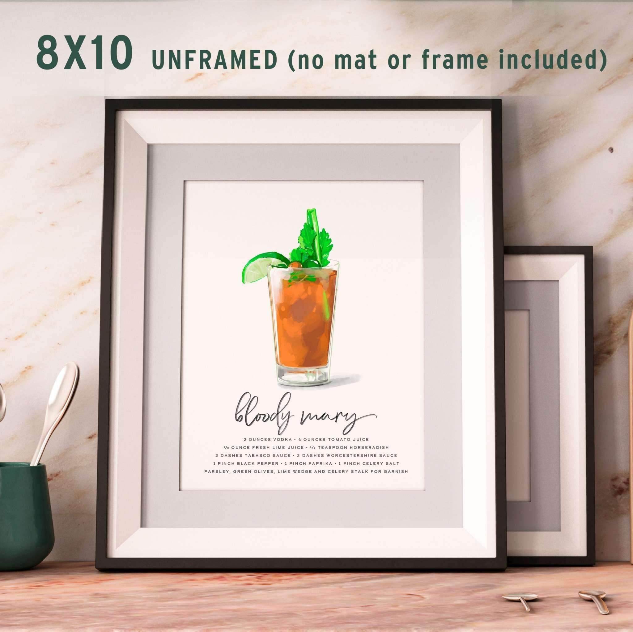 8x10 Bloody Mary recipe wall art displayed in a frame on a table, showcasing a detailed and vibrant cocktail illustration.