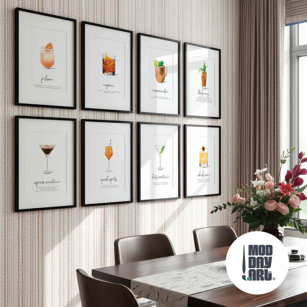 Framed cocktail illustrations on a wall above a dining table with a 'Mod Day Art' logo.