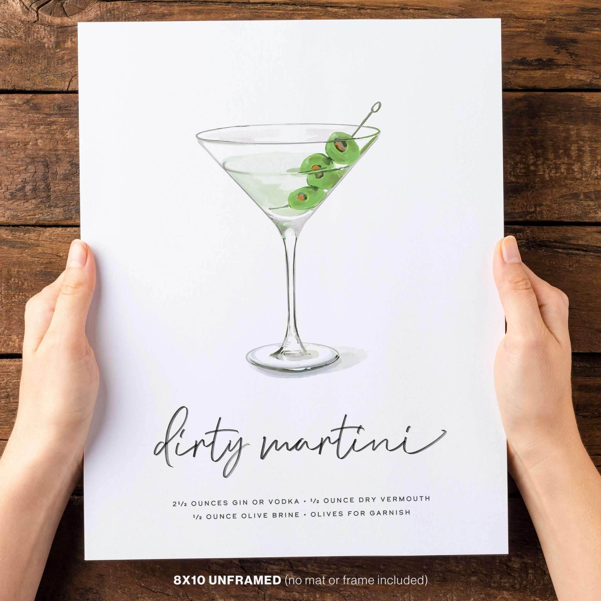 Hand holding our Dirty Martini recipe wall art with olives, 8x10 unframed illustration.