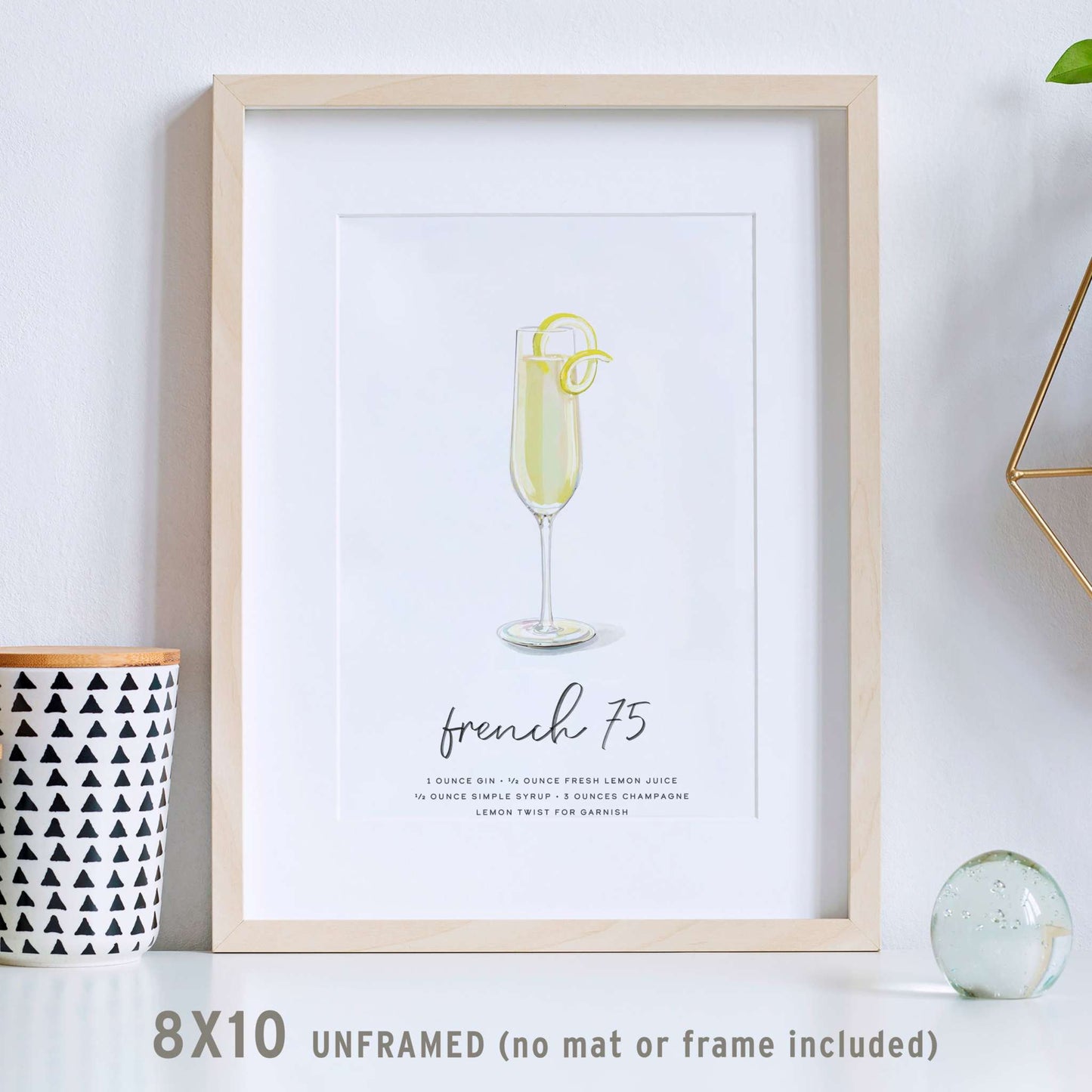 French 75 cocktail wall art print featuring a tall flute glass with lemon twist; unframed, 8×10 inches.