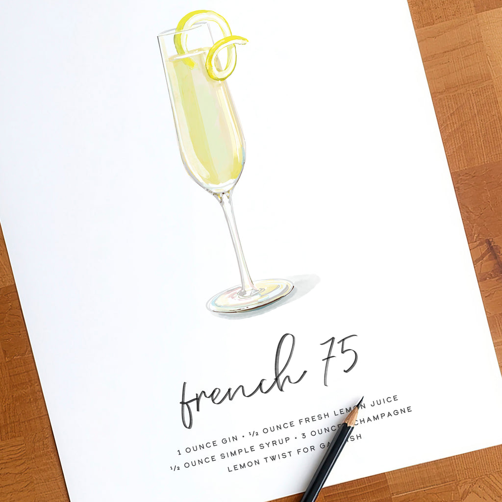 French 75 cocktail wall art print shown with a pencil for scale