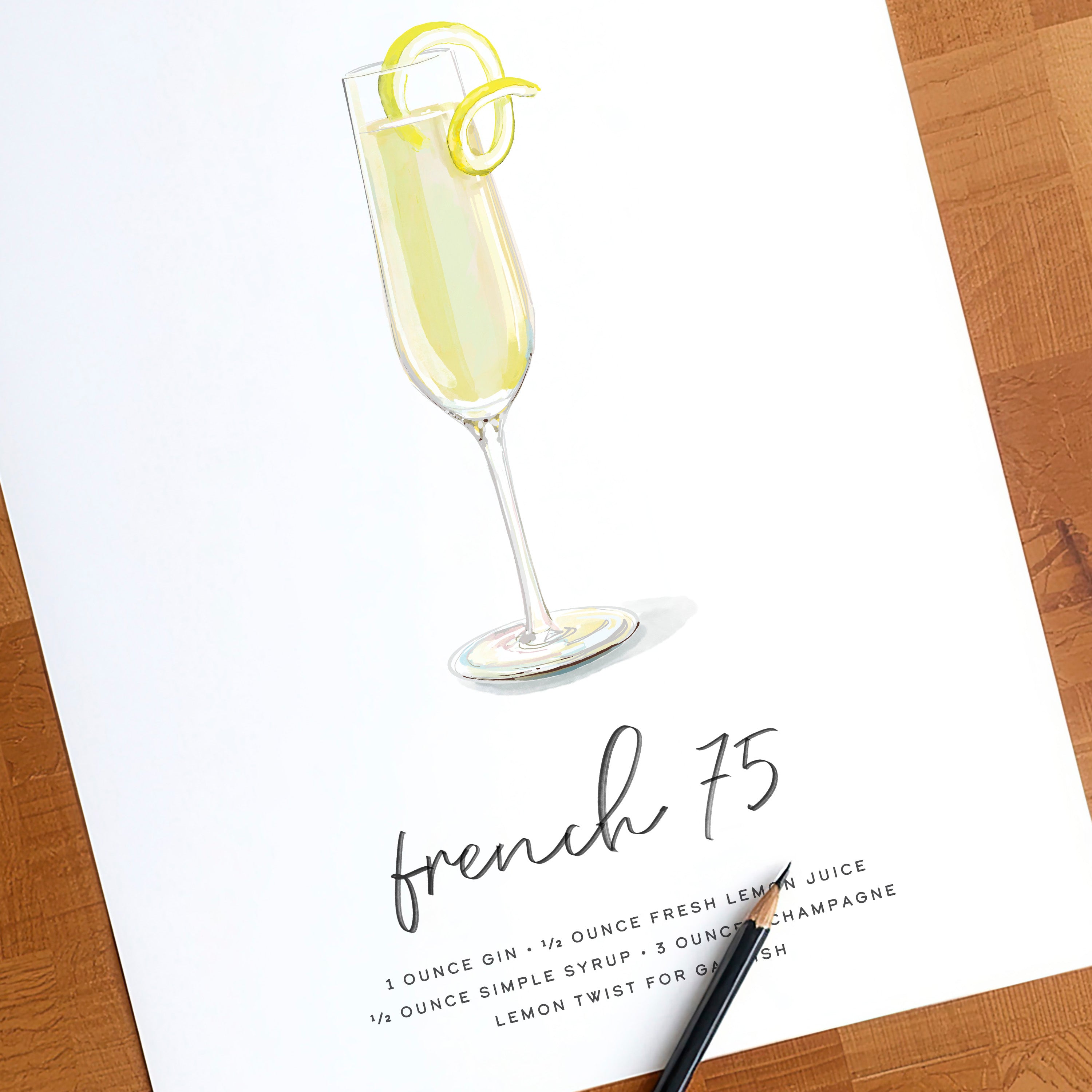 French 75 cocktail wall art print shown with a pencil for scale