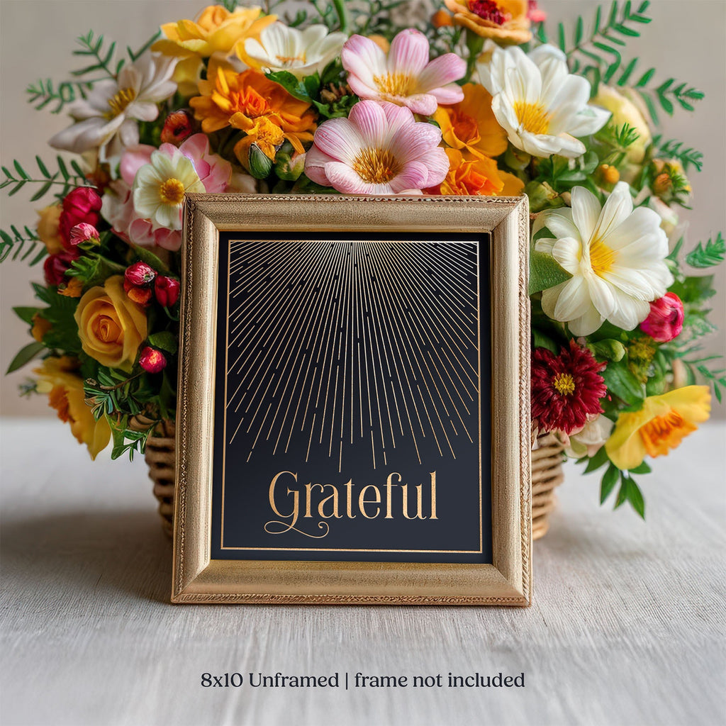 Decorative gold foil art print with 'Grateful' text in a gold frame, surrounded by colorful flowers.