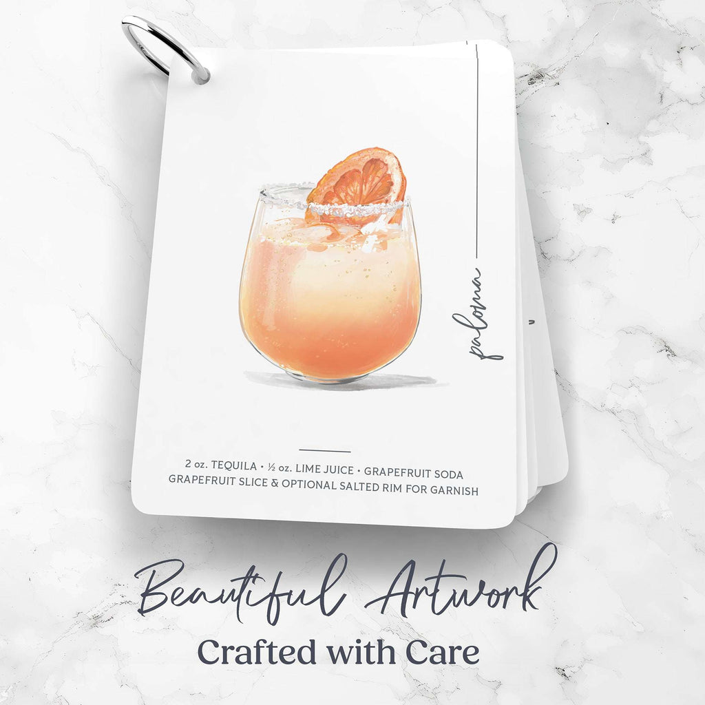 Cocktail recipe cards with a Paloma recipe cocktail illustration and recipe on a marble surface
