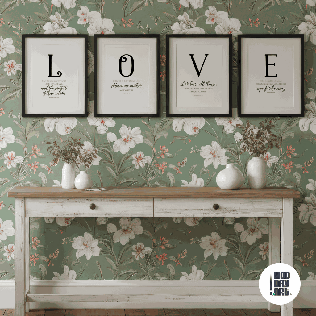Decorative wall with floral wallpaper, framed modern Christian wall decor spelling 'LOVE', and a wooden console table.