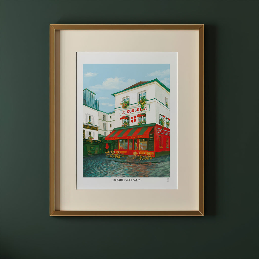 Framed artwork of Le Consulat cafe in Paris on a green wall.