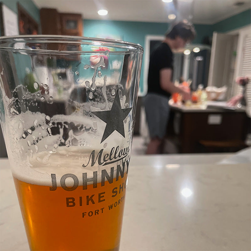 Lifestyle image of a draft beer served in a glass, set in a cozy home kitchen setting.