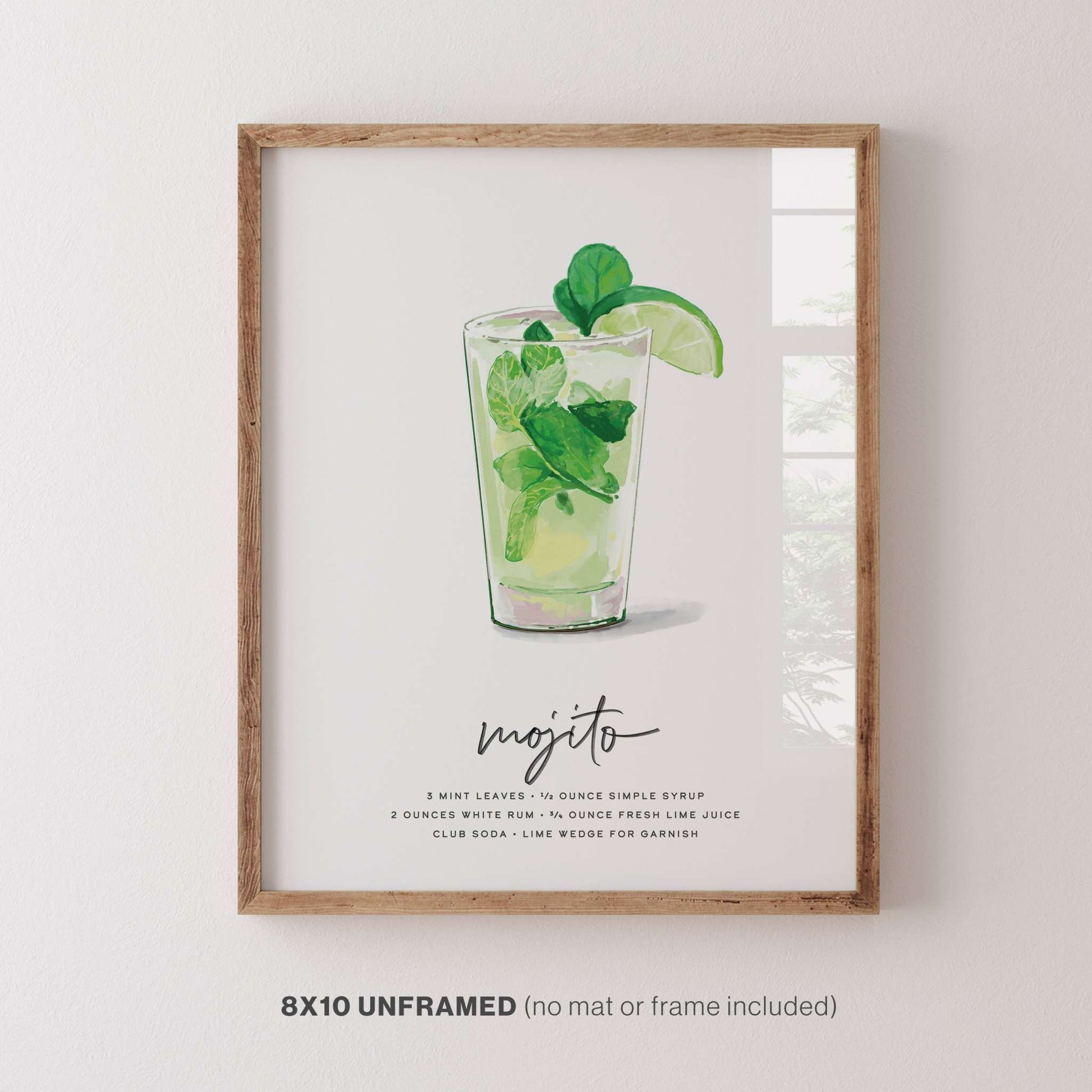 Framed Mojito Recipe Cocktail Wall Art featuring vibrant mint leaves and lime illustration, perfect for kitchen or bar decor, 8x10 inches (unframed option available).