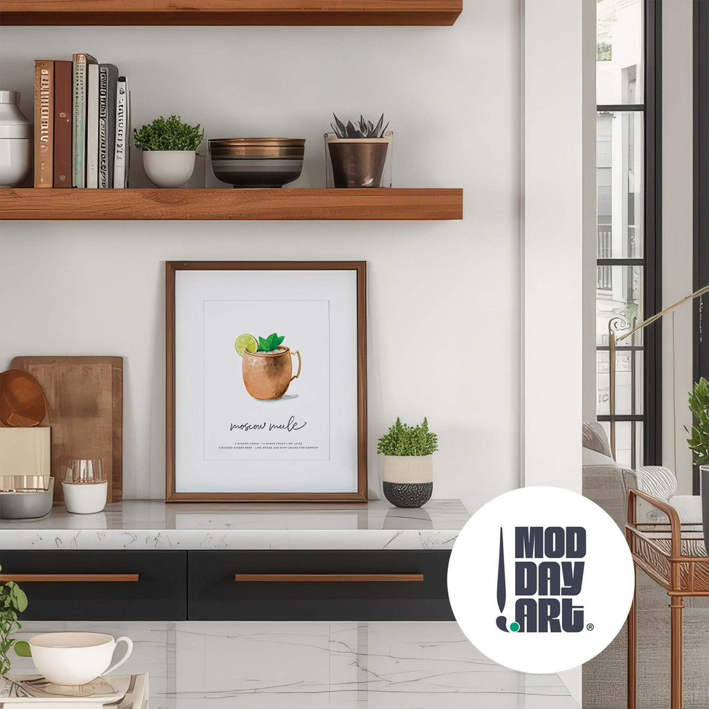 Modern interior with a framed Moscow Mule recipe cocktail wall art poster on a marble surface, wooden shelves with books and plants, and 'Mod Day Art' logo.