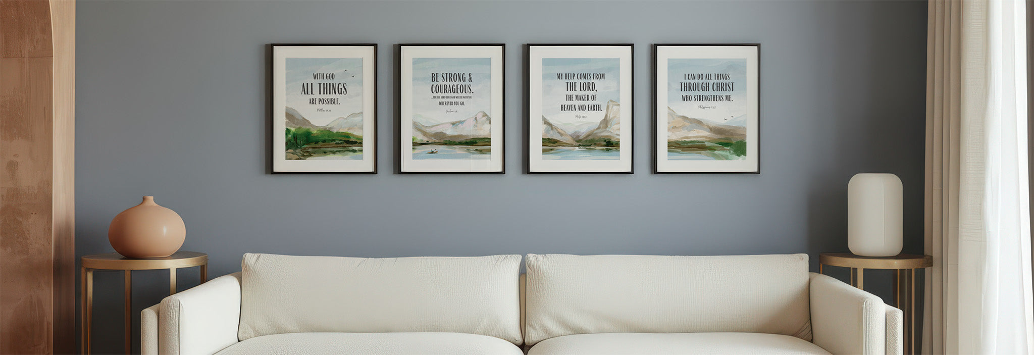 Living room with a beige sofa and four framed Christian wall art prints on a gray wall.