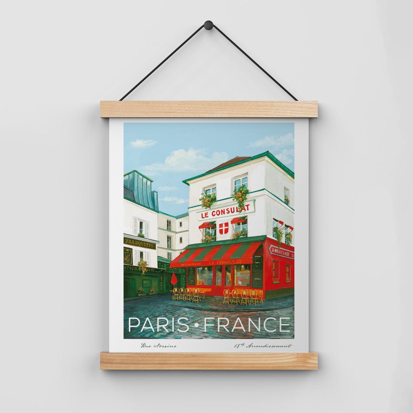 Le Consulat Paris Wall Art featuring a charming hand-drawn illustration of the iconic café, displayed in a poster hanger (hanger not included).