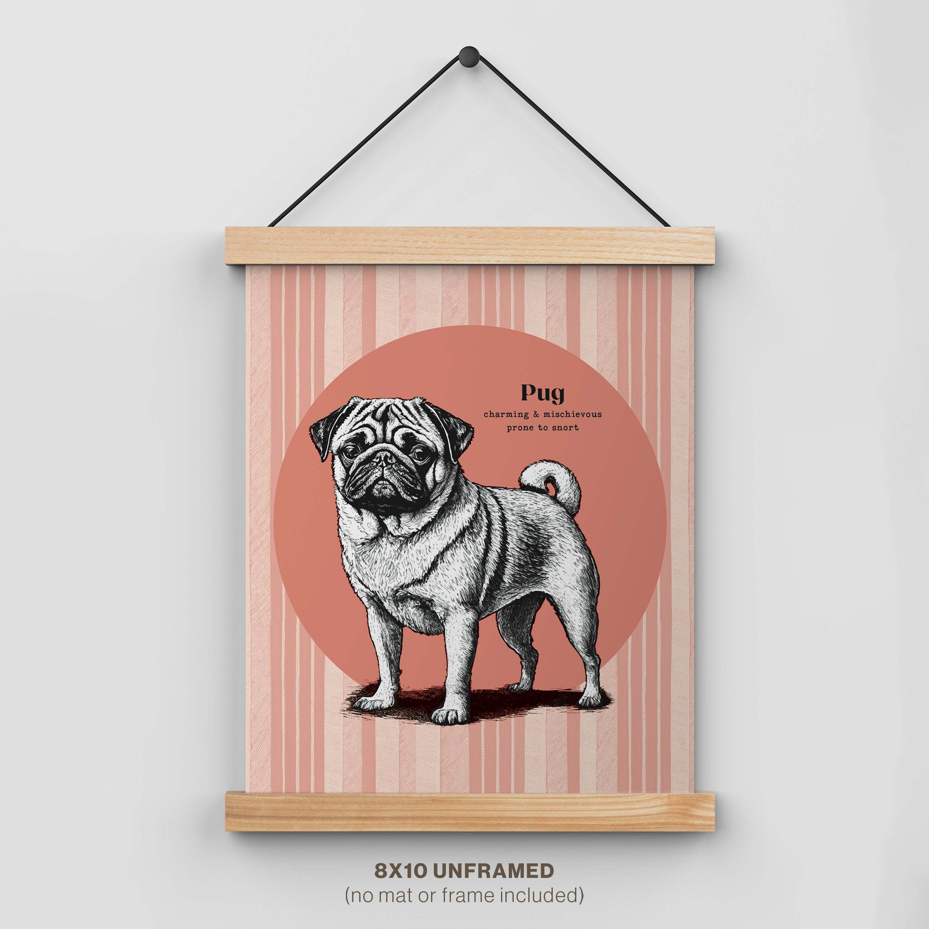 Pug dog art print with wooden hanger featuring vintage illustration on pink striped background. 8x10 unframed wall decor with "charming & mischievous, prone to snort" text.