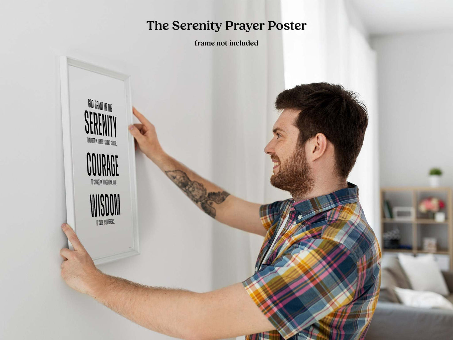 God grant me the serenity Wall Art in block print style being hung on white wall.