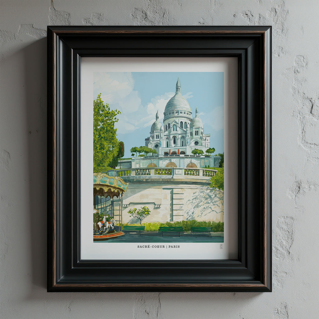 Framed artwork of the Sacré-Cœur Basilica in Paris on a textured wall.