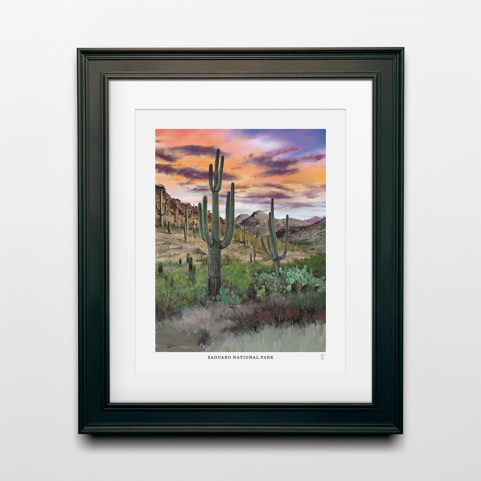 Hand-signed Saguaro National Park poster with cacti and desert landscape in a black frame, 8x10