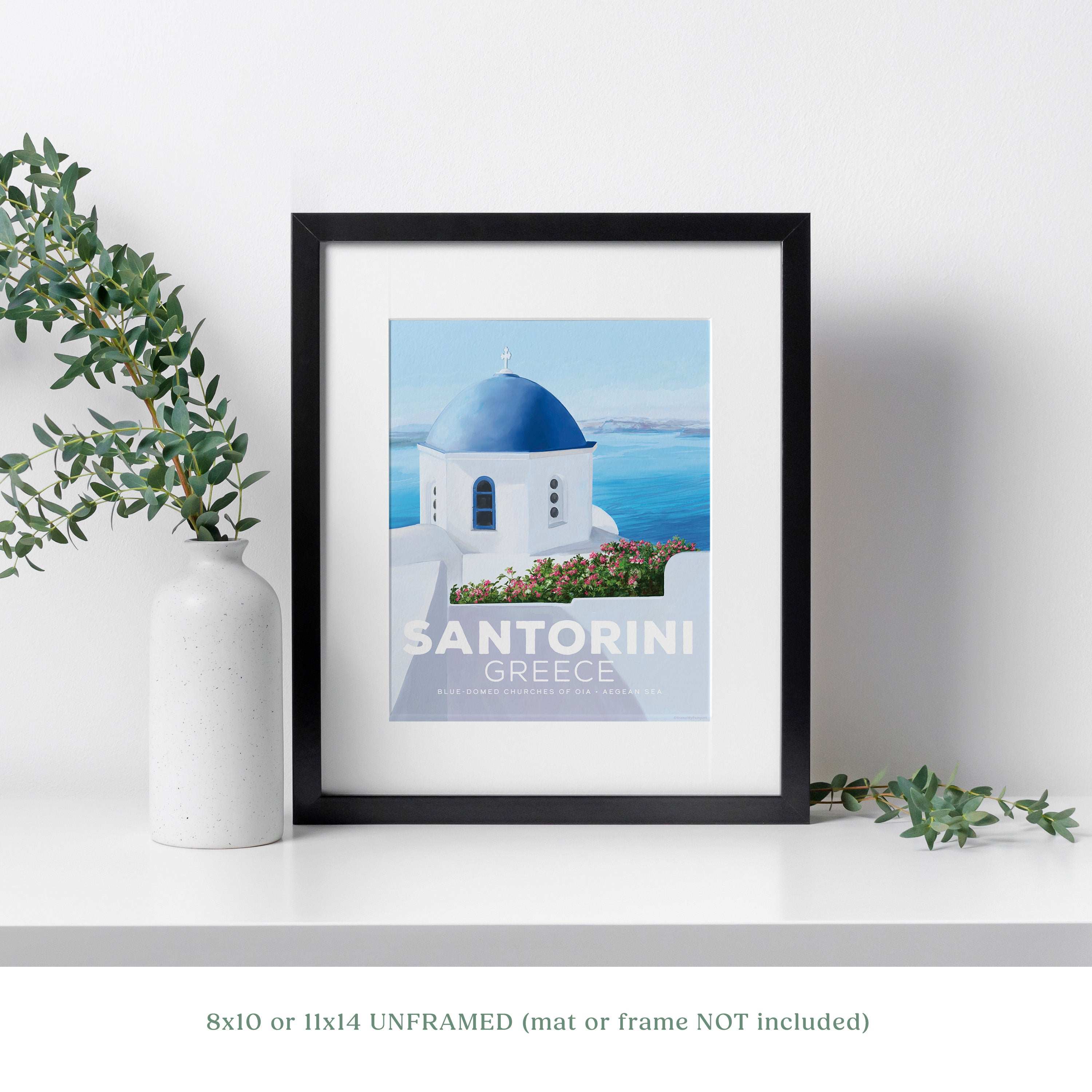 Santorini blue domes art print featuring iconic blue-domed church and Aegean Sea in black frame