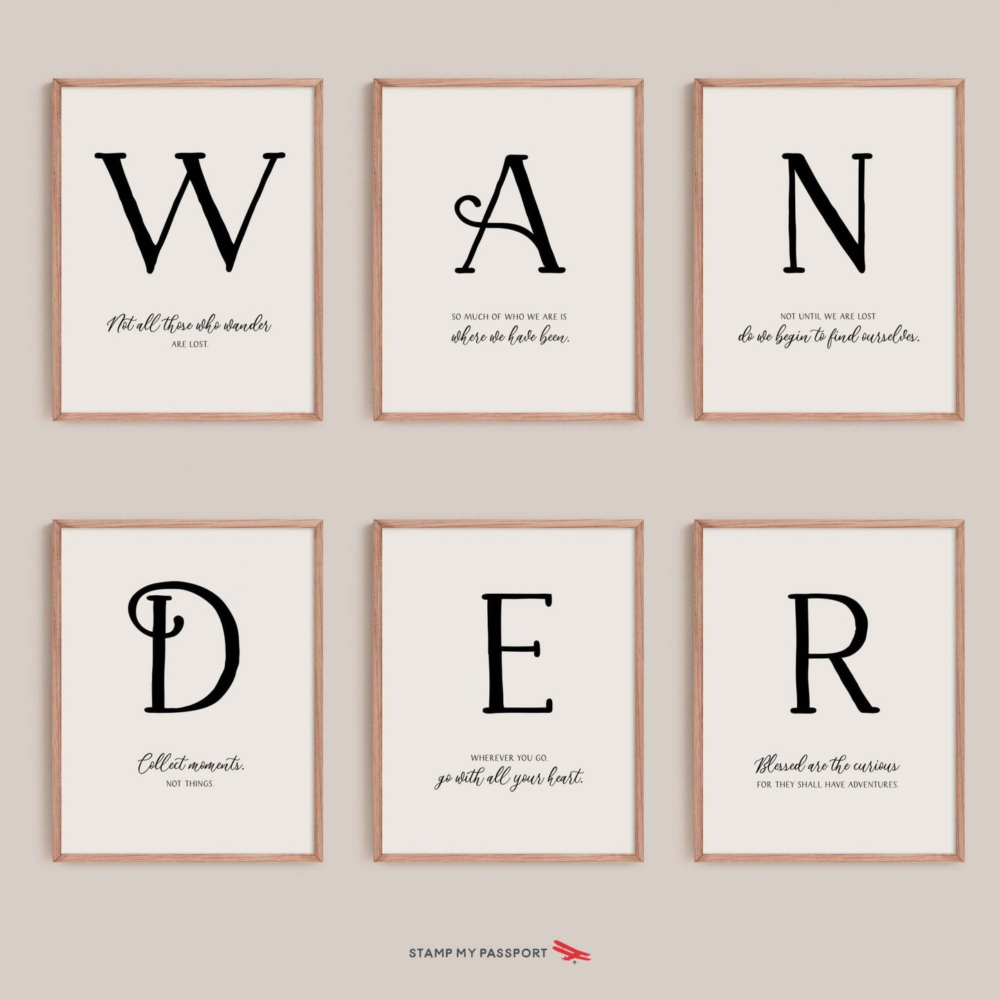 Wall art featuring wander quotes, elegantly framed in wood and displayed on a wall.