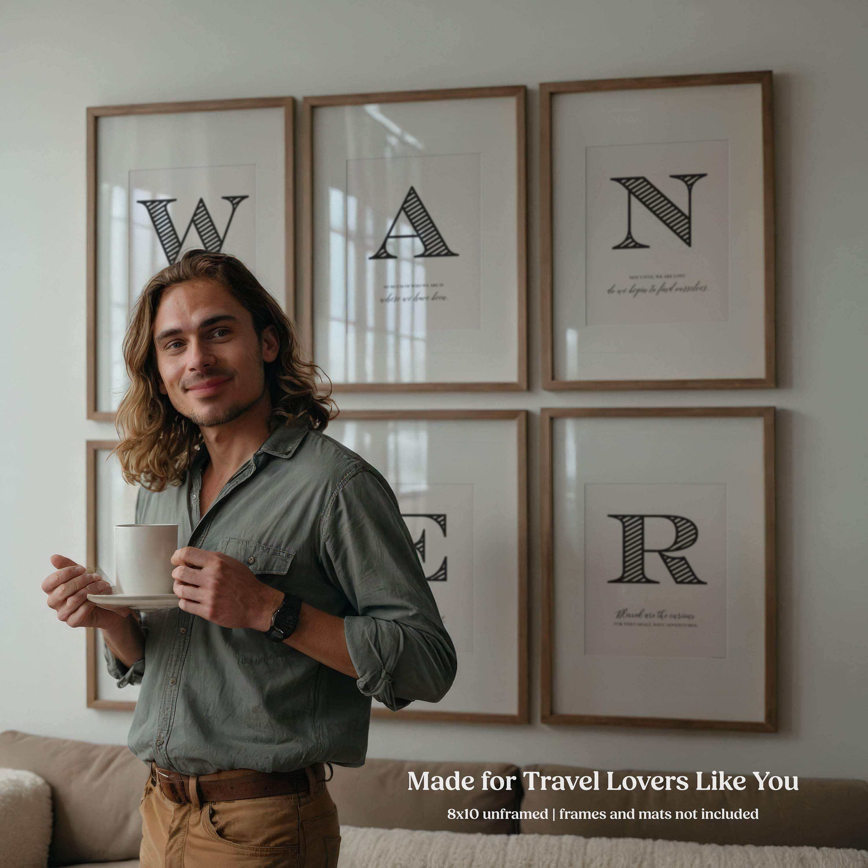 Man holding a cup in a room with framed travel quote wall art prints on the wall.