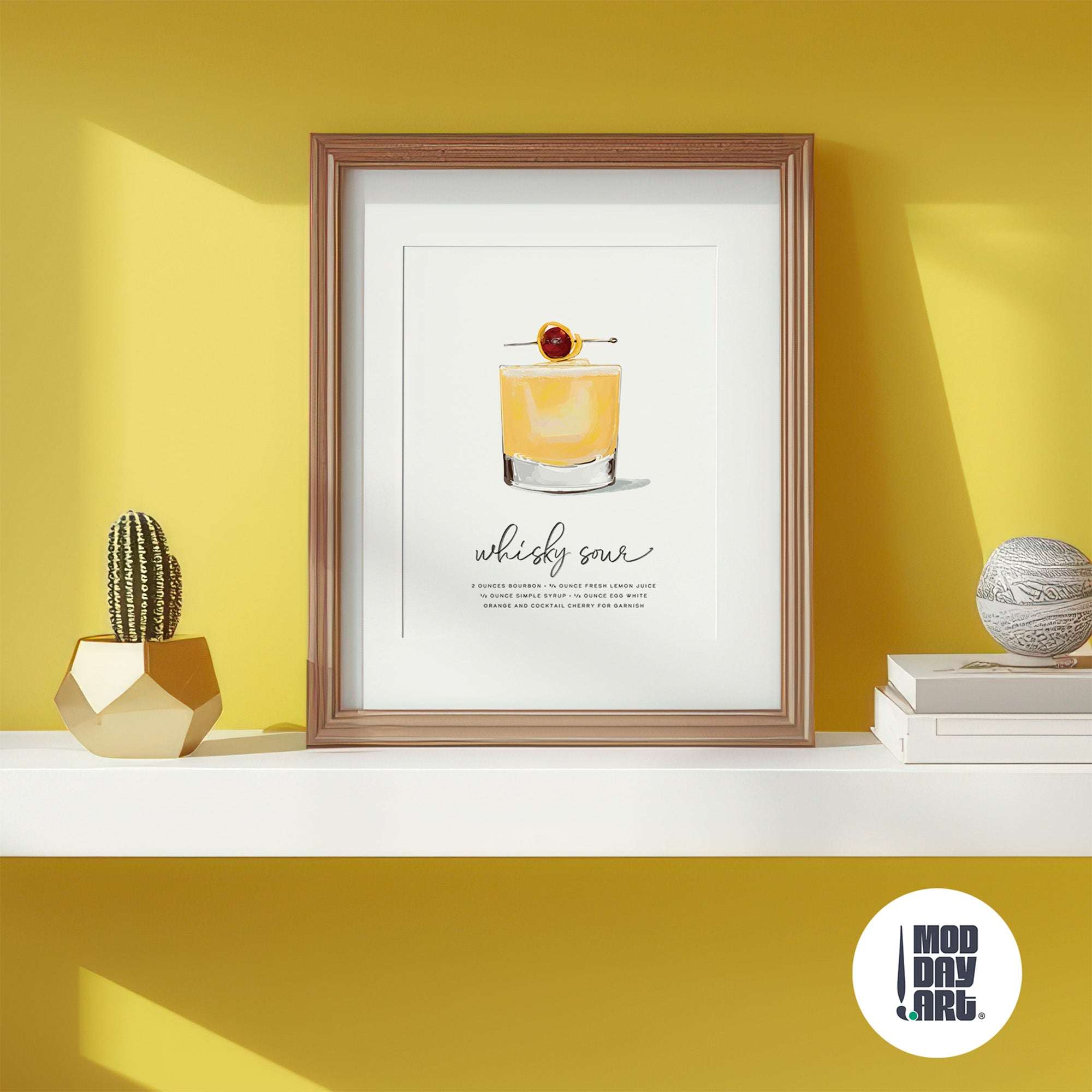 Framed whisky sour recipe cocktail wall art poster  on a shelf with decorative items against a yellow wall.