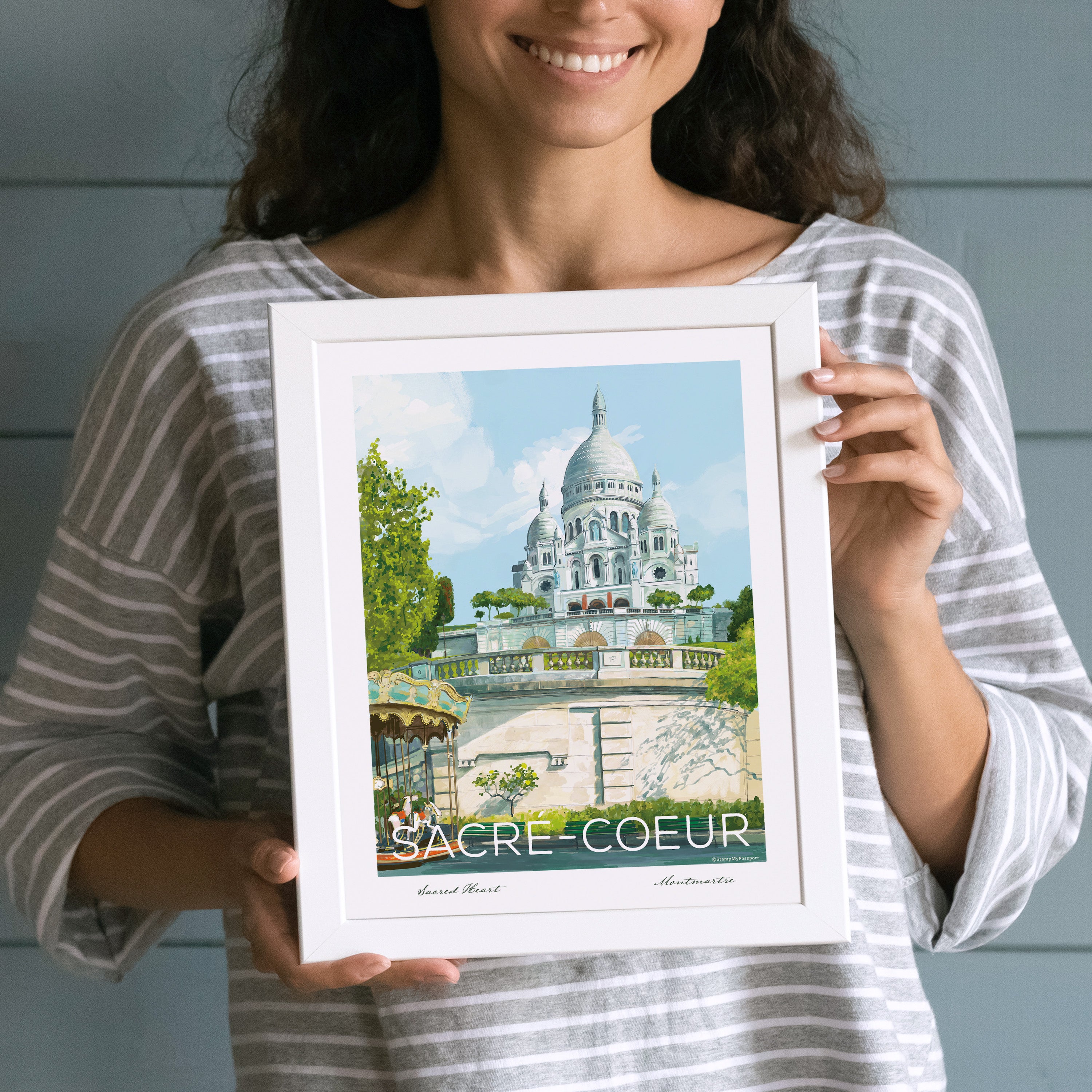 Woman holding the Sacré-Coeur Paris wall art print, showcasing the hand-drawn illustration.