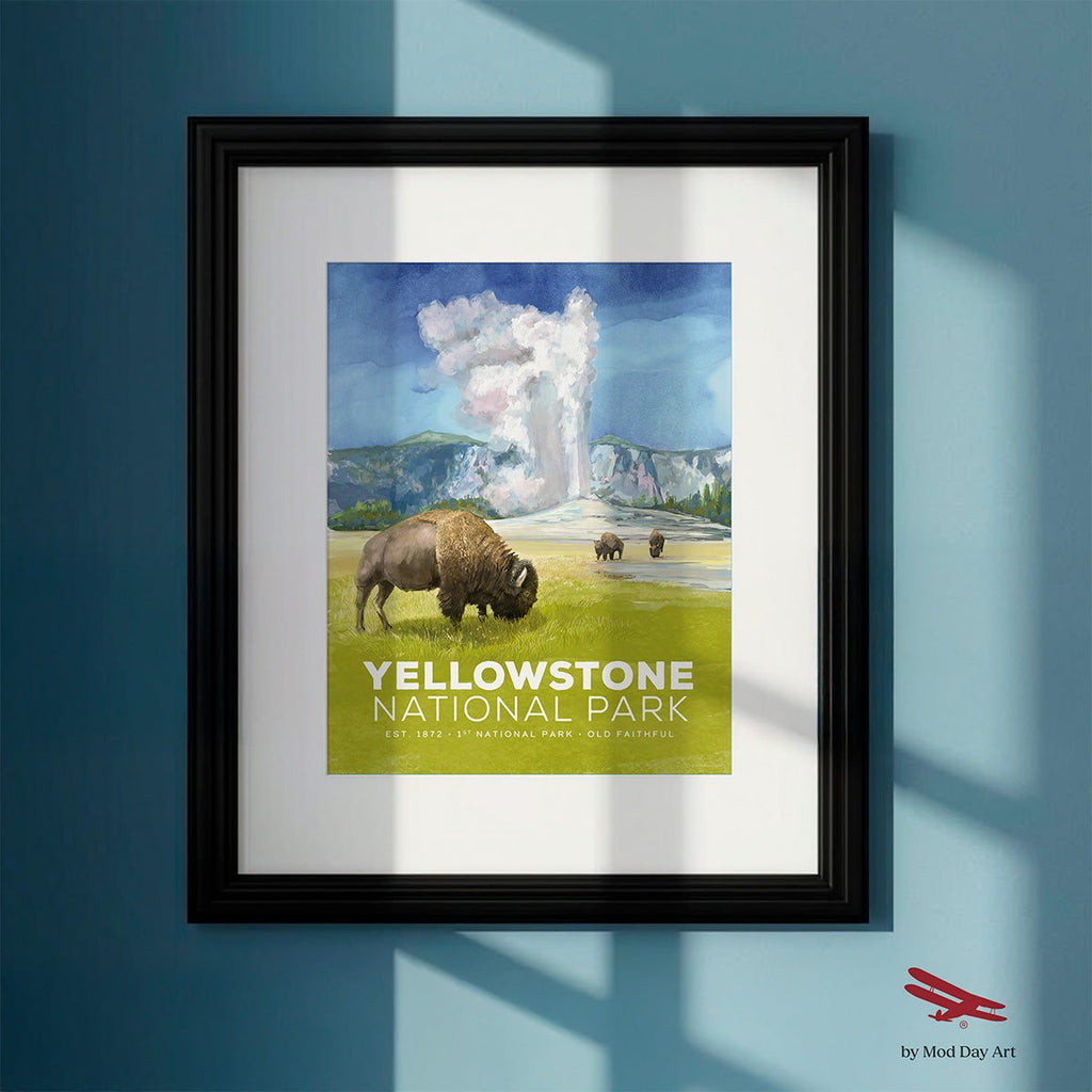 Framed poster of Yellowstone National Parks with a bison and mountain landscape on a blue wall.