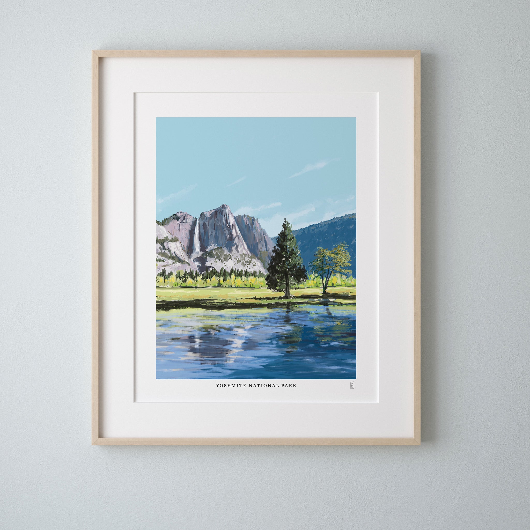 Framed artwork of Yosemite National Park with mountains and trees.