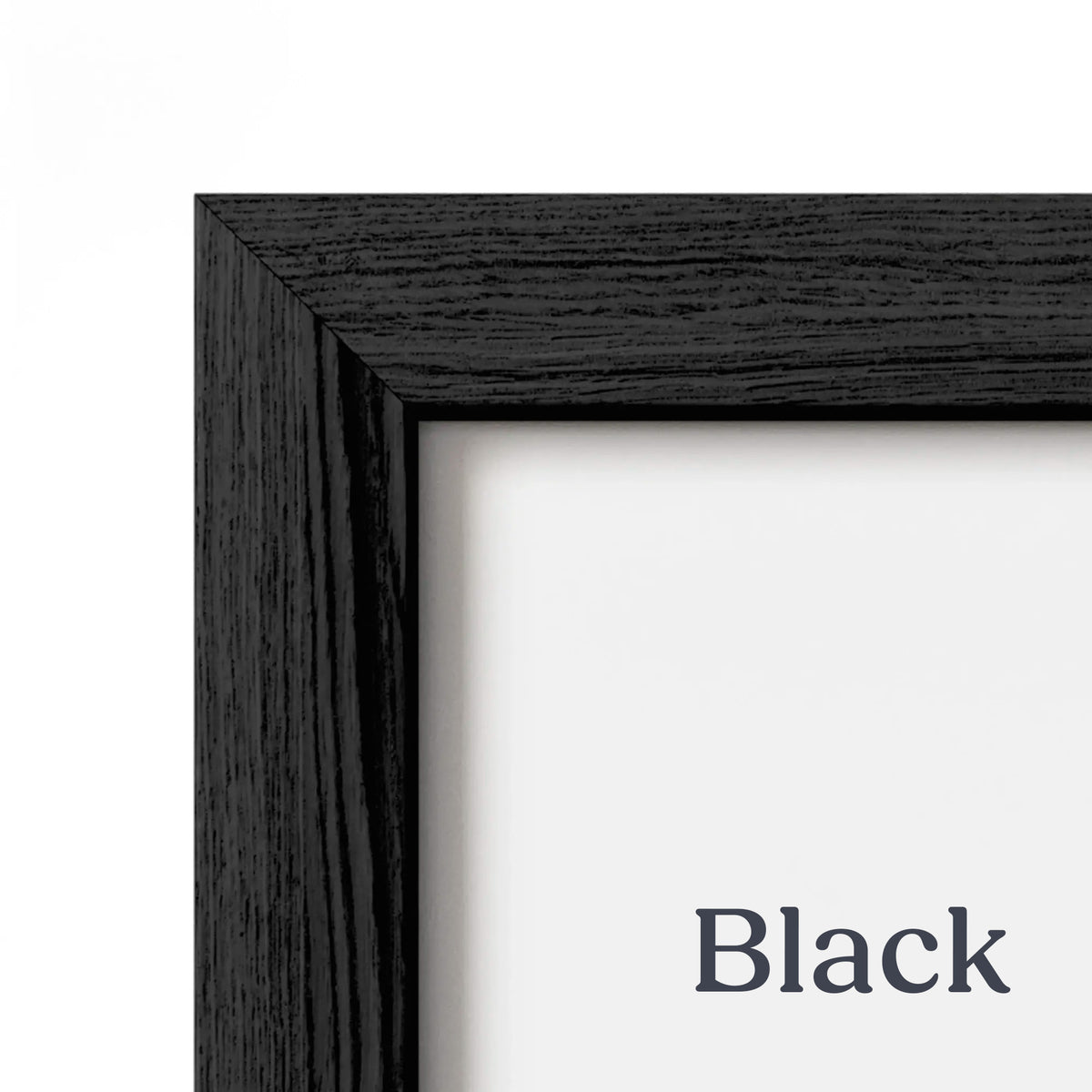 Close-up of the Premium Oak Picture Frame's Black Oak finish at the corner joint, showing the dark wood grain and white mat.